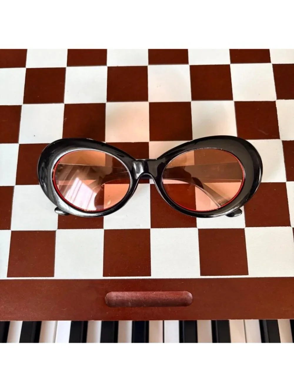 black clout goggles with orange tint